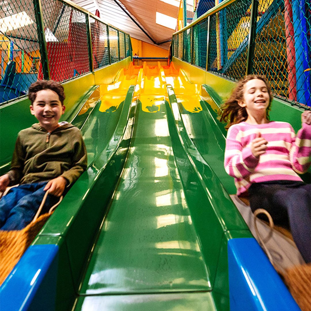 Image of kids going down the mammoth play ark slide web 1080x1080