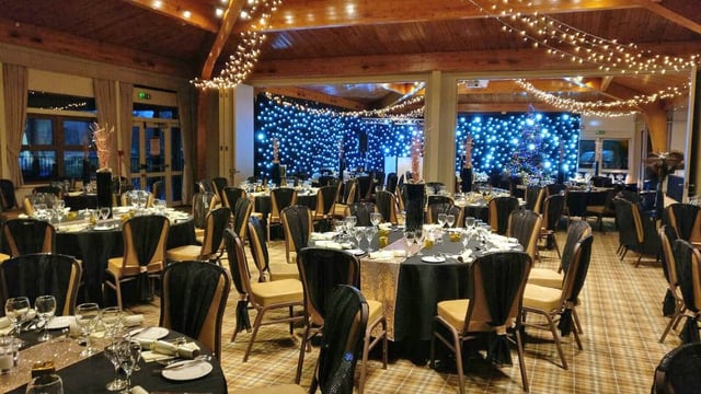 Black and gold Christmas decorations inside The Safari Lodge at Woburn Safari Park