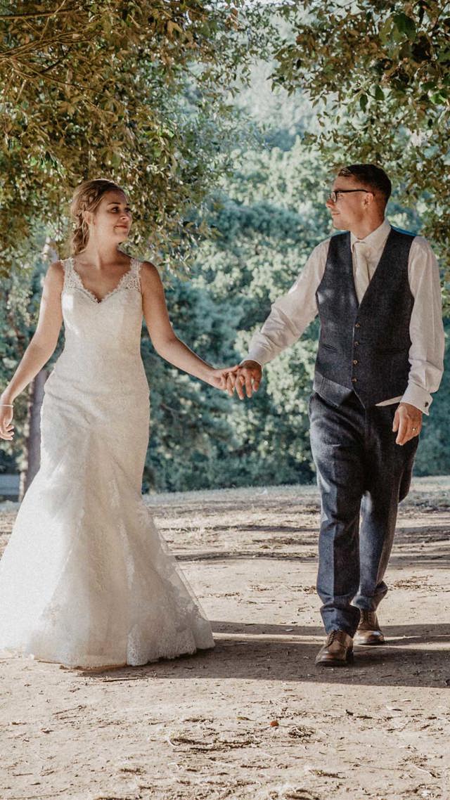 Image of couple walking through trees mob portrait 1080x1920 final