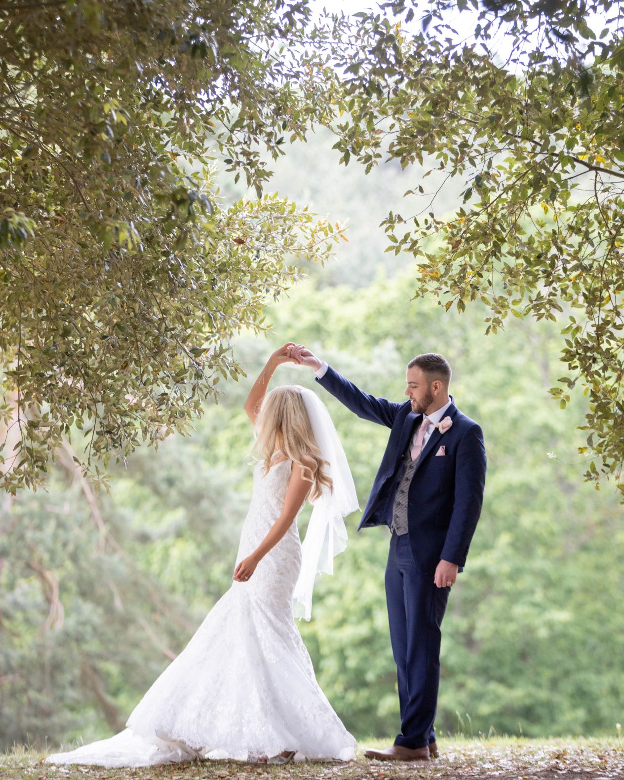 Bridge and groom dance in forest 